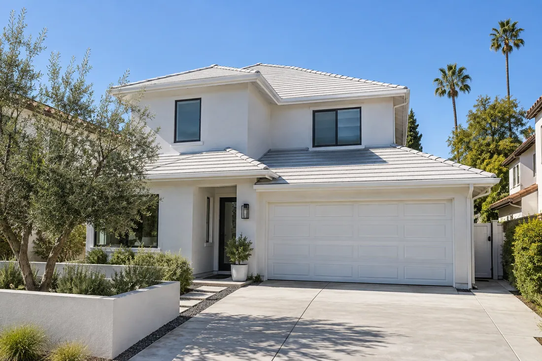Light-colored cool roof on a Los Angeles home, reflecting bright sun