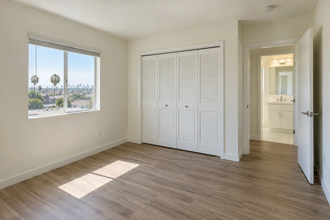 Empty rental unit in Los Angeles after turnover with fresh neutral paint and vinyl plank floors