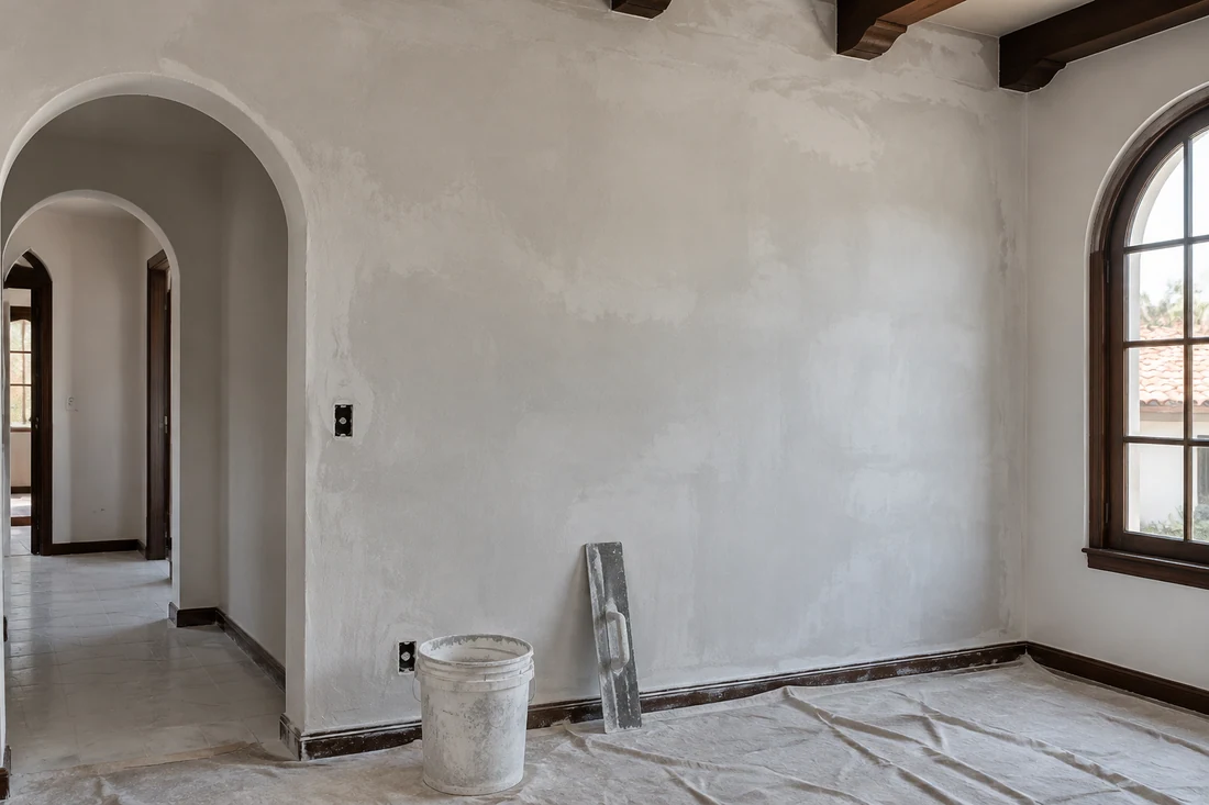 Plaster wall in an older Los Angeles home freshly skim-coated smooth before primer